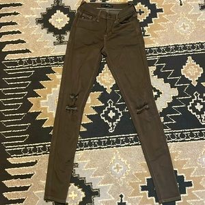 Kancan distressed olive skinny jeans.
